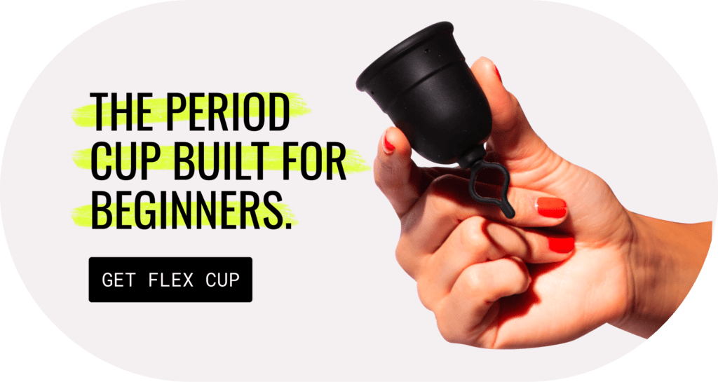 a woman's hand holding a flex period cup